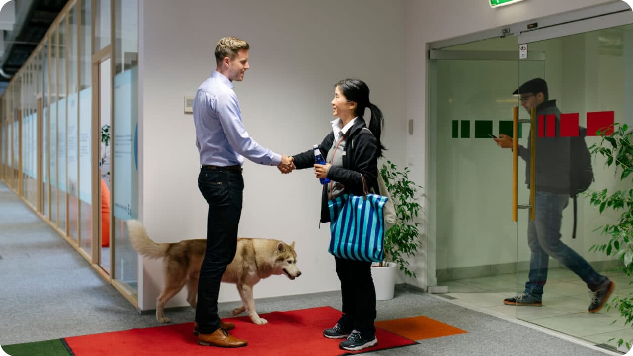 Man and woman shaking hands in the office
