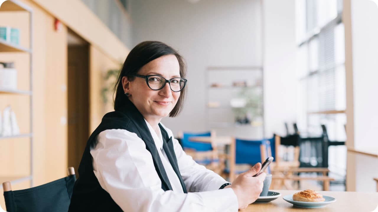 a woman with glasses working