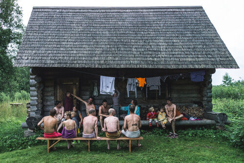 A traditional sauna house with a party of sauna-goers in Estonia